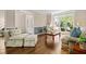 Cozy living room features hardwood floors, neutral paint, and large windows offering an abundance of natural light at 844 Nob Ridge Dr, Marietta, GA 30064
