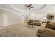 The living room features a tray ceiling, recessed lighting, neutral walls and carpet, and comfortable furnishings at 844 Nob Ridge Dr, Marietta, GA 30064