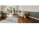 Bright living room featuring hardwood floors, wainscoting, and a large window with natural light at 844 Nob Ridge Dr, Marietta, GA 30064