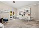 This bright living space features neutral walls and carpet, white shelving, and patio access, perfect for entertaining at 844 Nob Ridge Dr, Marietta, GA 30064