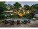 Beautiful pool area with lounge chairs and umbrella, perfect for relaxing and enjoying the outdoors at 844 Nob Ridge Dr, Marietta, GA 30064