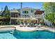 Beautiful backyard featuring a pool, hot tub, patio, and multi-level deck, surrounded by mature trees and landscaping at 844 Nob Ridge Dr, Marietta, GA 30064