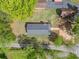 An aerial view captures the house with its gray roof and adjacent yard, revealing its positioning within the neighborhood at 1809 Cassville Nw Rd, Cartersville, GA 30121