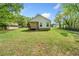 The expansive backyard offers a serene view of the home's exterior at 1809 Cassville Nw Rd, Cartersville, GA 30121