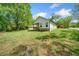 The expansive backyard offers a serene view of the home's exterior at 1809 Cassville Nw Rd, Cartersville, GA 30121