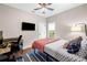 Bedroom with wood floors, bright window, and desk at 1809 Cassville Nw Rd, Cartersville, GA 30121