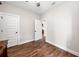 An empty bedroom features hardwood floors and white trim around the doors and baseboards at 1809 Cassville Nw Rd, Cartersville, GA 30121