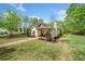 Charming home with manicured landscaping and inviting front porch, complemented by a lush green lawn at 1809 Cassville Nw Rd, Cartersville, GA 30121