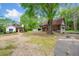Exterior view of a charming two-story home surrounded by mature trees and well-maintained landscaping at 1809 Cassville Nw Rd, Cartersville, GA 30121