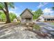 Rustic home featuring a vintage exterior with a weathered finish, complemented by a spacious front yard and surrounding greenery at 1809 Cassville Nw Rd, Cartersville, GA 30121