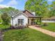 Charming exterior view of this beautifully landscaped home featuring a cozy front porch at 1809 Cassville Nw Rd, Cartersville, GA 30121