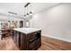 Kitchen island featuring dark wood accents, a microwave, and plenty of counter space at 1809 Cassville Nw Rd, Cartersville, GA 30121