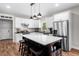 Eat-in kitchen with white cabinets, a large island, and stainless steel appliances, great for cooking at 1809 Cassville Nw Rd, Cartersville, GA 30121