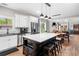 Modern kitchen featuring a large island with bar seating, stainless steel appliances and wood flooring at 1809 Cassville Nw Rd, Cartersville, GA 30121