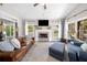 Inviting living room with fireplace and generous natural light streaming through multiple windows at 1809 Cassville Nw Rd, Cartersville, GA 30121
