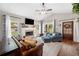 Bright living room with a fireplace, large windows, and comfortable seating at 1809 Cassville Nw Rd, Cartersville, GA 30121