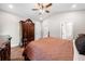 Spacious main bedroom features hardwood floors, ceiling fan, and large wardrobe at 1809 Cassville Nw Rd, Cartersville, GA 30121