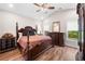 Elegant main bedroom suite with vaulted ceiling, hardwood floors, and classic wood furniture at 1809 Cassville Nw Rd, Cartersville, GA 30121