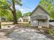 A charming home with a well-maintained exterior is set back from the street, near a vintage building at 1809 Cassville Nw Rd, Cartersville, GA 30121