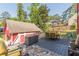 Large back deck with outdoor seating and dining area, nestled in a lush backyard, perfect for gatherings and enjoying nature at 2733 Winburn Ter, East Point, GA 30344