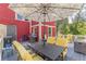Outdoor deck with ample seating and table under a large umbrella, perfect for entertaining and enjoying the outdoors at 2733 Winburn Ter, East Point, GA 30344