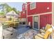 Spacious back deck with outdoor seating under a large umbrella and a mix of seating options, offering an ideal entertaining space at 2733 Winburn Ter, East Point, GA 30344