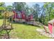 Expansive backyard with a deck, swing and lush greenery, perfect for outdoor entertaining at 2733 Winburn Ter, East Point, GA 30344
