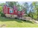 Spacious backyard featuring a stone foundation and a deck, perfect for outdoor gatherings at 2733 Winburn Ter, East Point, GA 30344