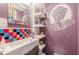 Unique bathroom featuring bright tile and decorative skull shelving at 2733 Winburn Ter, East Point, GA 30344