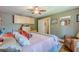 Inviting bedroom with ceiling fan, wood floors, and neutral wall color with accent decor at 2733 Winburn Ter, East Point, GA 30344