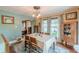 Inviting dining room enhanced by natural light, blending traditional charm with ample space for gatherings at 2733 Winburn Ter, East Point, GA 30344