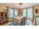 Bright dining room featuring classic decor, natural light, and ample space for entertaining, creating a warm, inviting atmosphere at 2733 Winburn Ter, East Point, GA 30344
