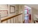 Bright hallway features hardwood floors, decor, and doorway views of an office at 2733 Winburn Ter, East Point, GA 30344