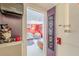 Hallway leading to a living room with bright decor and colorful wall art at 2733 Winburn Ter, East Point, GA 30344