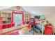 Bright home office featuring built-in shelving, storage, natural light and a hardwood floor at 2733 Winburn Ter, East Point, GA 30344