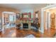 Living room features a stone fireplace, hardwood floors, and an open view into the dining room at 2733 Winburn Ter, East Point, GA 30344