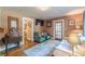 Cozy living room features hardwood floors, neutral walls, stylish furniture, and natural light at 2733 Winburn Ter, East Point, GA 30344