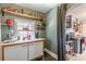This butler's pantry with extra counter space features a charming display of vintage kitchenalia at 2733 Winburn Ter, East Point, GA 30344