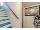 Finished basement stairwell with an interesting decoration and finished walls at 2733 Winburn Ter, East Point, GA 30344