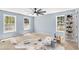Bedroom featuring neutral carpet, windows, a ceiling fan, and shoe storage on the back of the door at 2958 Paul Harris Rd, Dallas, GA 30157