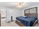 Bedroom featuring a ceiling fan, carpeted floor, and wood bed frame at 2958 Paul Harris Rd, Dallas, GA 30157