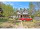 Charming two-story home with tan siding, a cozy front porch, and a well-maintained front yard at 2958 Paul Harris Rd, Dallas, GA 30157