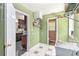 Practical laundry area with a utility sink and ample shelving space at 2958 Paul Harris Rd, Dallas, GA 30157