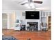 Bright living room features hardwood flooring, fireplace and built-in cabinets at 2958 Paul Harris Rd, Dallas, GA 30157