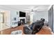 Spacious living room featuring a fireplace, hardwood floors, and a ceiling fan at 2958 Paul Harris Rd, Dallas, GA 30157