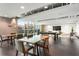 Modern community room with tables, chairs, and a TV for socializing and entertaining at 361 17Th Nw St # 1708, Atlanta, GA 30363