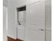 Modern stacked washer and dryer units in a closet behind louvered door at 361 17Th Nw St # 1708, Atlanta, GA 30363