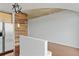 Living space with stainless fridge and a wood accent wall at 361 17Th Nw St # 1708, Atlanta, GA 30363