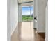 Bright living room features hardwood floors and a large window with scenic views at 361 17Th Nw St # 1708, Atlanta, GA 30363