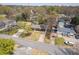 Aerial view of a single-story home with a long driveway, a well-kept lawn, and surrounding neighborhood at 43 Lott Se Ave, Marietta, GA 30067
